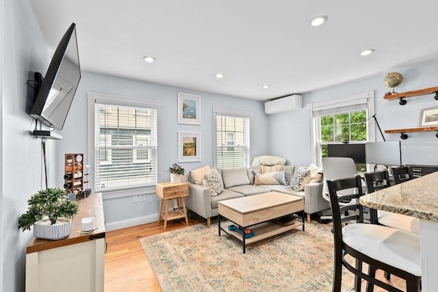13 Emmet St Unit 1, Boston, MA 02127 - living room featuring a wall mounted AC, plenty of natural light, light wood-type flooring, recessed lighting, and baseboards