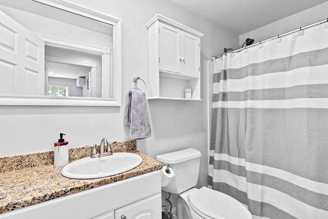 13 Emmet St Unit 1, Boston, MA 02127 - bathroom with vanity, toilet, and a shower with curtain