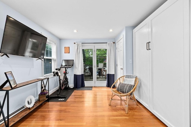13 Emmet St Unit 1, Boston, MA 02127 - workout area featuring light wood-style flooring, recessed lighting, a baseboard radiator, and baseboards