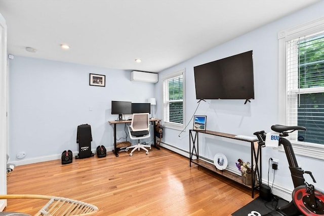 13 Emmet St Unit 1, Boston, MA 02127 - home office with a wall mounted AC, wood finished floors, baseboards, and recessed lighting