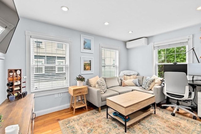 13 Emmet St Unit 1, Boston, MA 02127 - home office with a wall mounted air conditioner, plenty of natural light, light wood-style flooring, recessed lighting, and baseboards