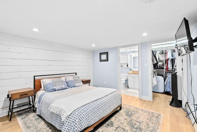 13 Emmet St Unit 1, Boston, MA 02127 - bedroom featuring a spacious closet, light wood-style floors, a closet, ensuite bath, and recessed lighting