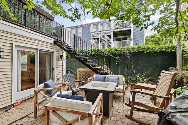 13 Emmet St Unit 1, Boston, MA 02127 - view of patio featuring stairway and an outdoor fire pit