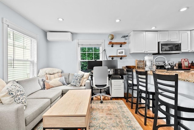 13 Emmet St Unit 1, Boston, MA 02127 - office area featuring a wall mounted air conditioner, recessed lighting, and wood finished floors