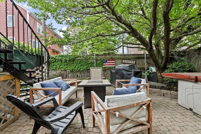 13 Emmet St Unit 1, Boston, MA 02127 - view of patio / terrace featuring an outdoor living space with a fire pit