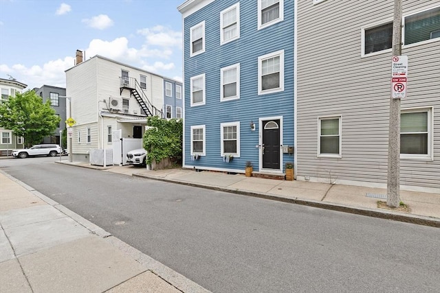 13 Emmet St Unit 1, Boston, MA 02127 - view of asphalt street featuring sidewalks, traffic signs, and curbs