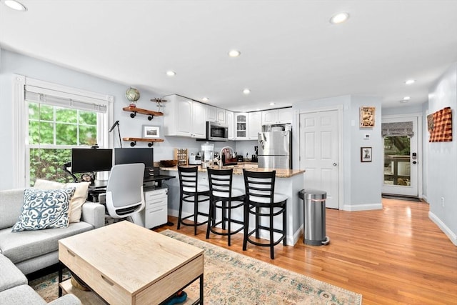 13 Emmet St Unit 1, Boston, MA 02127 - living room featuring light wood-style floors, recessed lighting, and baseboards