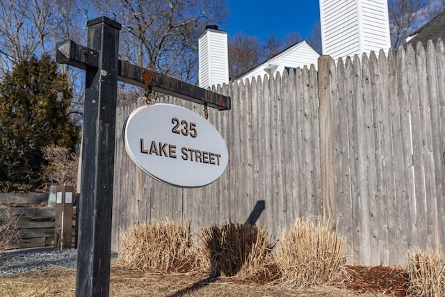 community sign with fence