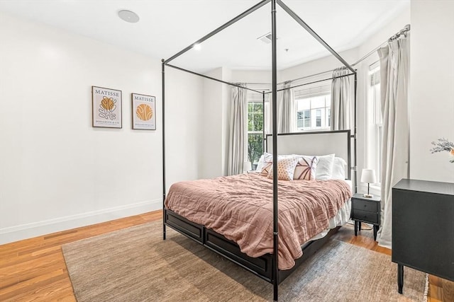 239 Lexington St Unit 2, Boston, MA 02128 - bedroom with wood finished floors and baseboards