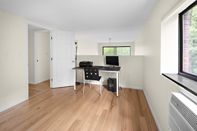 993 Massachusetts Ave Unit 127, Arlington, MA 02476 - office area featuring wood finished floors, baseboards, and a wall mounted AC