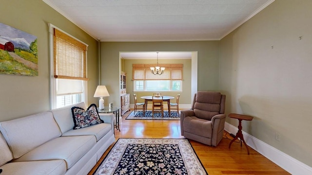 30 Hartshorn Ave, Worcester, MA 01602 - living area featuring wood finished floors, a chandelier, crown molding, and baseboards