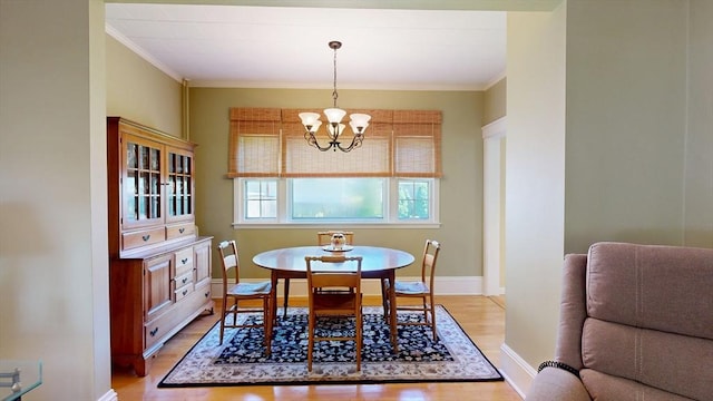 30 Hartshorn Ave, Worcester, MA 01602 - dining space featuring a chandelier, light wood-style floors, ornamental molding, and baseboards