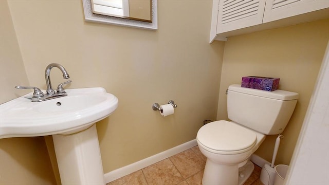 30 Hartshorn Ave, Worcester, MA 01602 - bathroom with toilet, baseboards, tile patterned flooring, and a sink