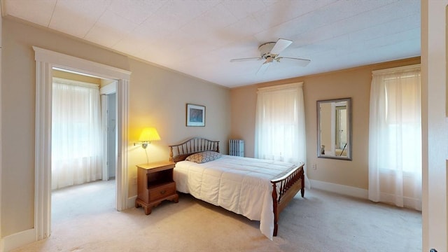 30 Hartshorn Ave, Worcester, MA 01602 - bedroom with light colored carpet, radiator, a ceiling fan, and baseboards