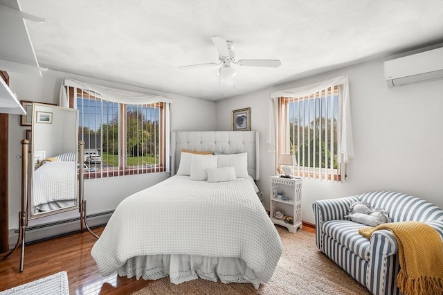 bedroom featuring a baseboard radiator, a wall mounted AC, wood finished floors, and ceiling fan