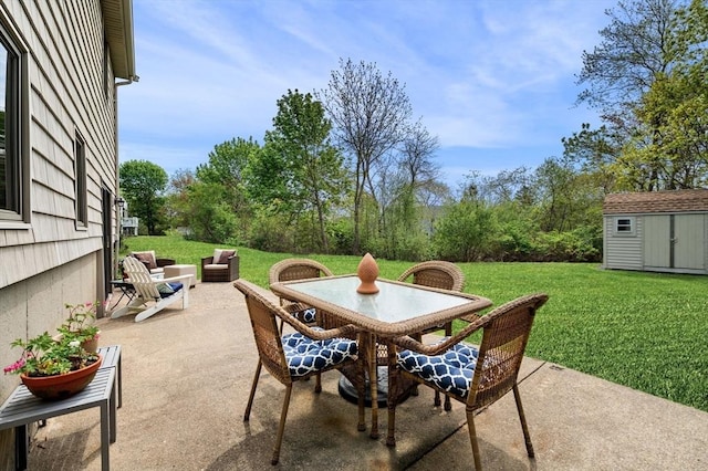 view of patio / terrace featuring outdoor dining space, a storage shed, and an outdoor structure