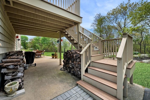 view of patio / terrace featuring stairs and outdoor dining area