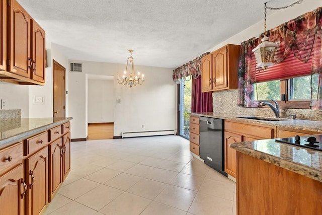 kitchen with an inviting chandelier, a healthy amount of sunlight, baseboard heating, a sink, and black appliances