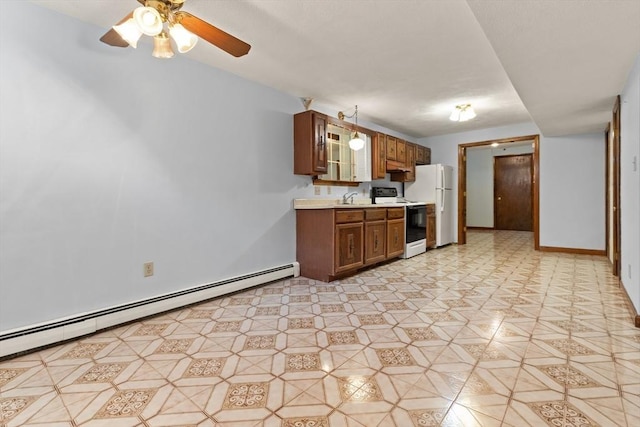 kitchen with a ceiling fan, electric range, baseboard heating, light countertops, and light floors