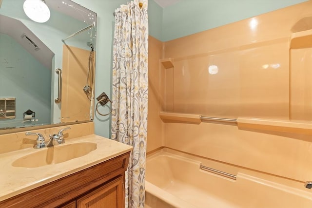 bathroom featuring visible vents, shower / bath combination with curtain, and vanity