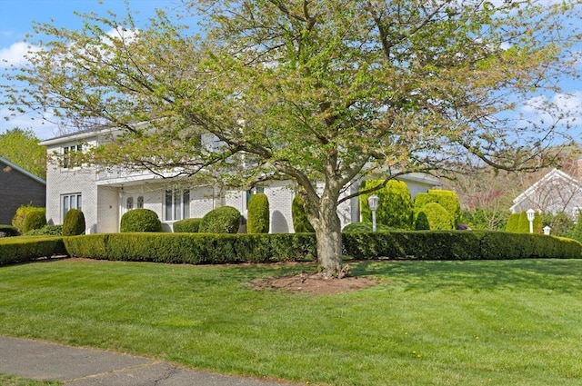 view of property exterior with a yard
