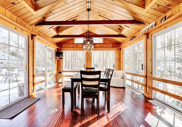 sunroom featuring wood ceiling, plenty of natural light, and vaulted ceiling