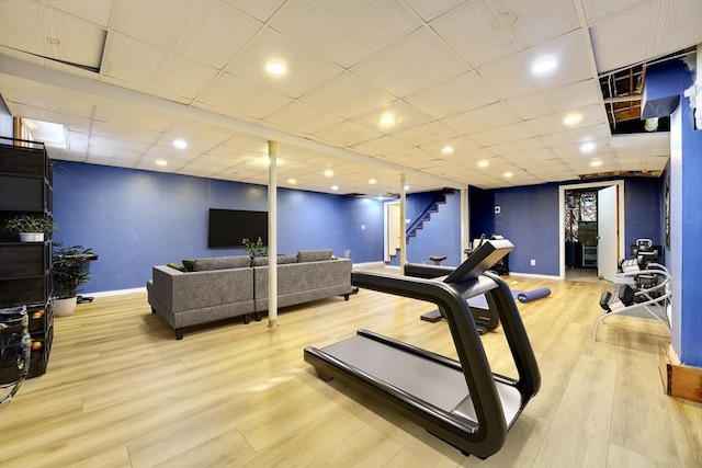 workout room with light hardwood / wood-style floors