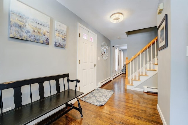 foyer entrance featuring a baseboard radiator and wood-type flooring