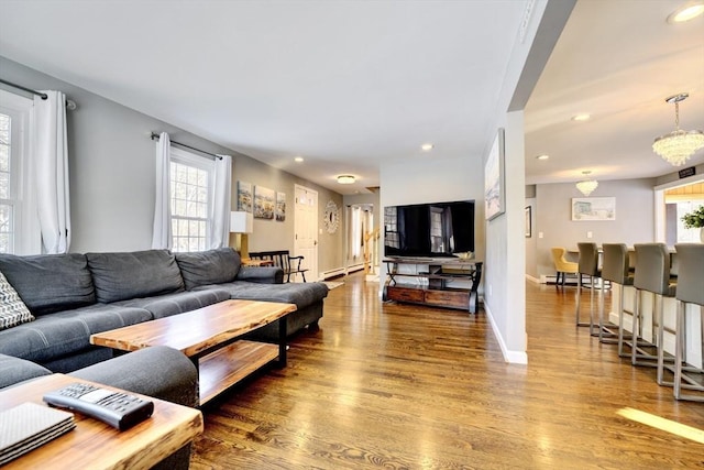 living room with a baseboard radiator and hardwood / wood-style floors