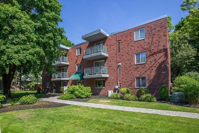 view of property featuring central AC unit