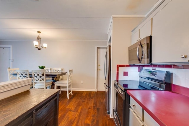 kitchen featuring stainless steel appliances, dark wood-style flooring, white cabinetry, ornamental molding, and tasteful backsplash