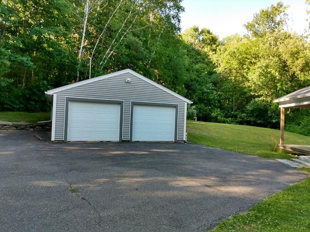 garage featuring a yard