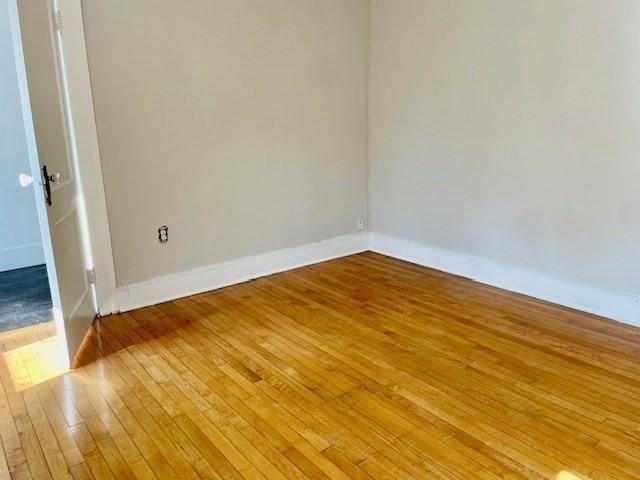 unfurnished room featuring light hardwood / wood-style floors