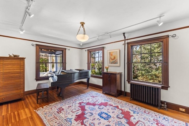 10 Quissett, Falmouth, MA 02543 - office with track lighting, radiator heating unit, and wood finished floors