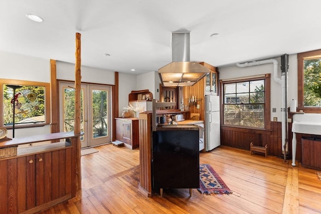 10 Quissett, Falmouth, MA 02543 - kitchen featuring freestanding refrigerator, island range hood, light wood finished floors, recessed lighting, and a sink