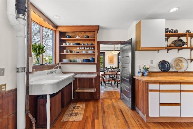 10 Quissett, Falmouth, MA 02543 - kitchen featuring open shelves, wood-type flooring, white cabinetry, recessed lighting, and butcher block countertops