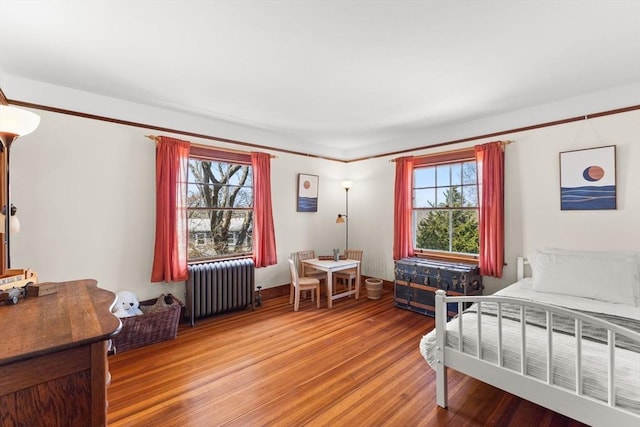 10 Quissett, Falmouth, MA 02543 - bedroom featuring radiator heating unit and wood finished floors