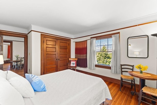 10 Quissett, Falmouth, MA 02543 - bedroom with wood finished floors, baseboards, and a closet