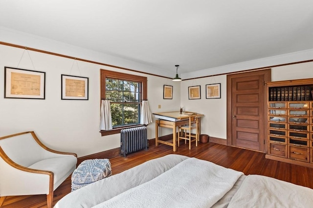 10 Quissett, Falmouth, MA 02543 - bedroom with radiator, wood finished floors, baseboards, and ornamental molding