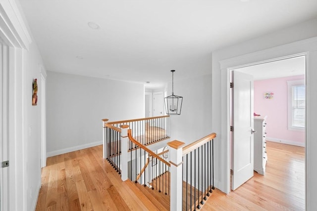 hall with light hardwood / wood-style flooring