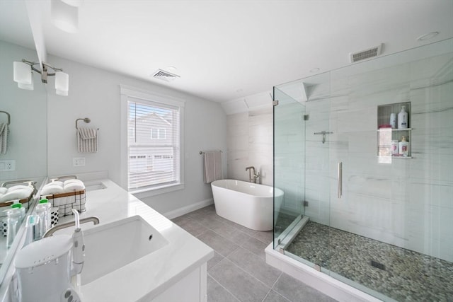 bathroom featuring shower with separate bathtub, radiator, vanity, and tile patterned floors