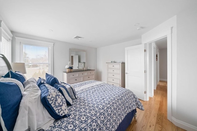 bedroom with light hardwood / wood-style floors