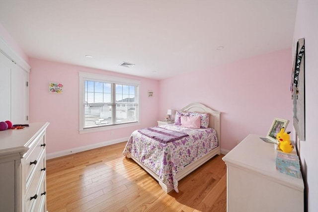 bedroom with light wood-type flooring