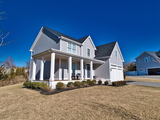 view of front of home with a front yard and a porch