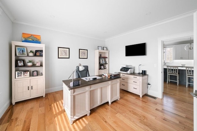 office featuring ornamental molding and light hardwood / wood-style floors