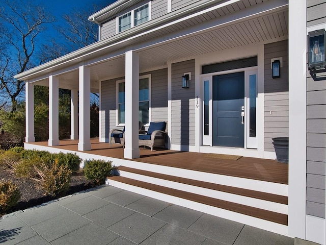 property entrance featuring a porch