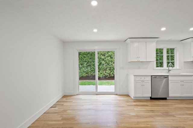 176 Palmer Ave Unit 2, Falmouth, MA 02540 - kitchen featuring stainless steel dishwasher, white cabinets, healthy amount of natural light, and recessed lighting