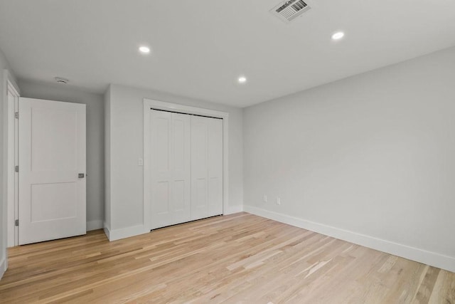176 Palmer Ave Unit 2, Falmouth, MA 02540 - unfurnished bedroom with baseboards, light wood-type flooring, recessed lighting, and a closet