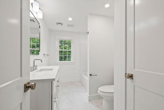 176 Palmer Ave Unit 2, Falmouth, MA 02540 - bathroom with vanity, toilet, baseboards, marble finish floors, and recessed lighting