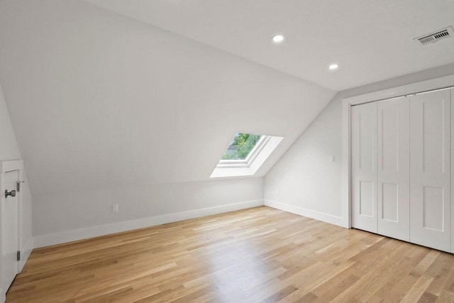 176 Palmer Ave Unit 2, Falmouth, MA 02540 - additional living space with a skylight, vaulted ceiling, light wood finished floors, baseboards, and recessed lighting